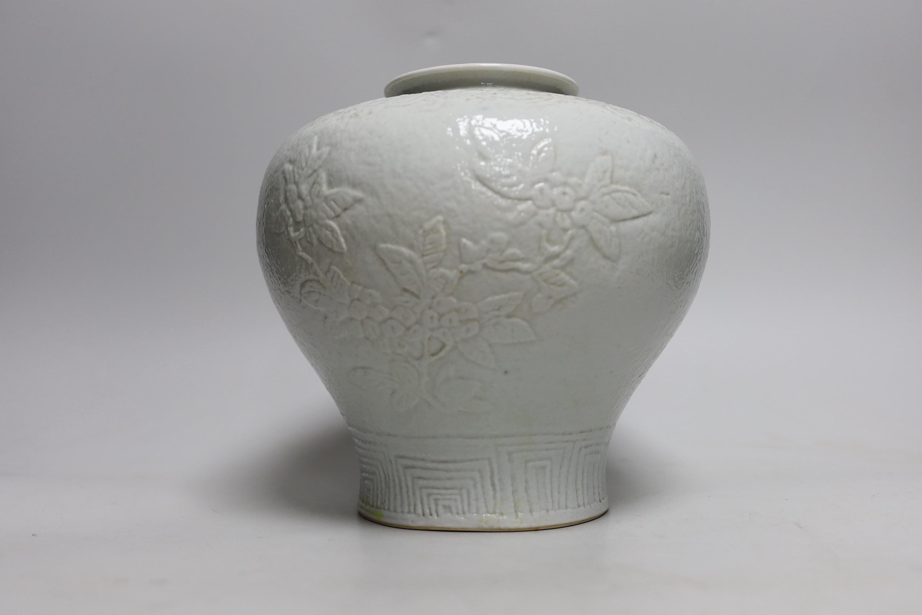 A Chinese moulded white glazed vase, early 20th century, 20cm